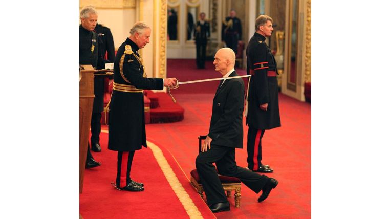 Nick White being knighted