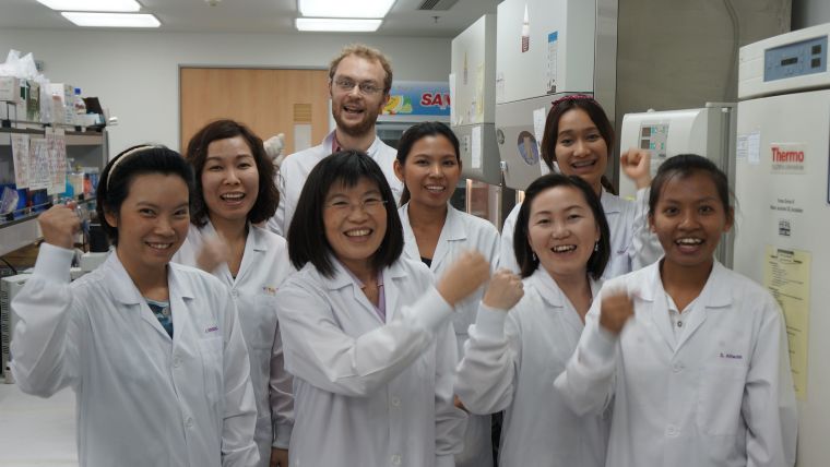 Group photo of researchers in a lab